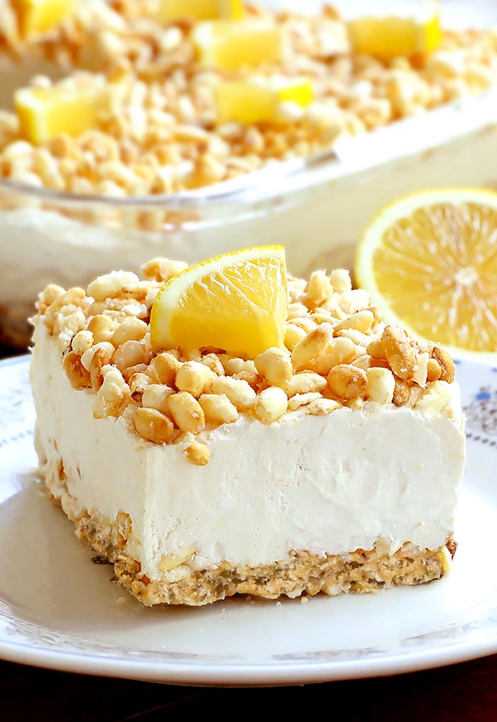 A rice krispie crust filled with creamy lemonade filling, this Lemonade Krispie Dessert recipe will be your favorite summertime treat.