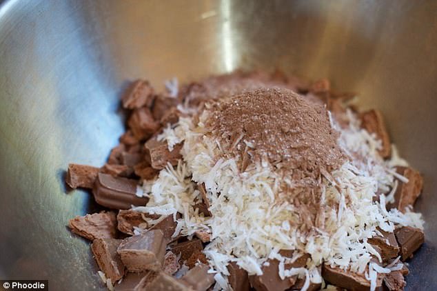 Mixing shredded coconut and Tim Tams with cocoa powder for an extra chocolaty taste  