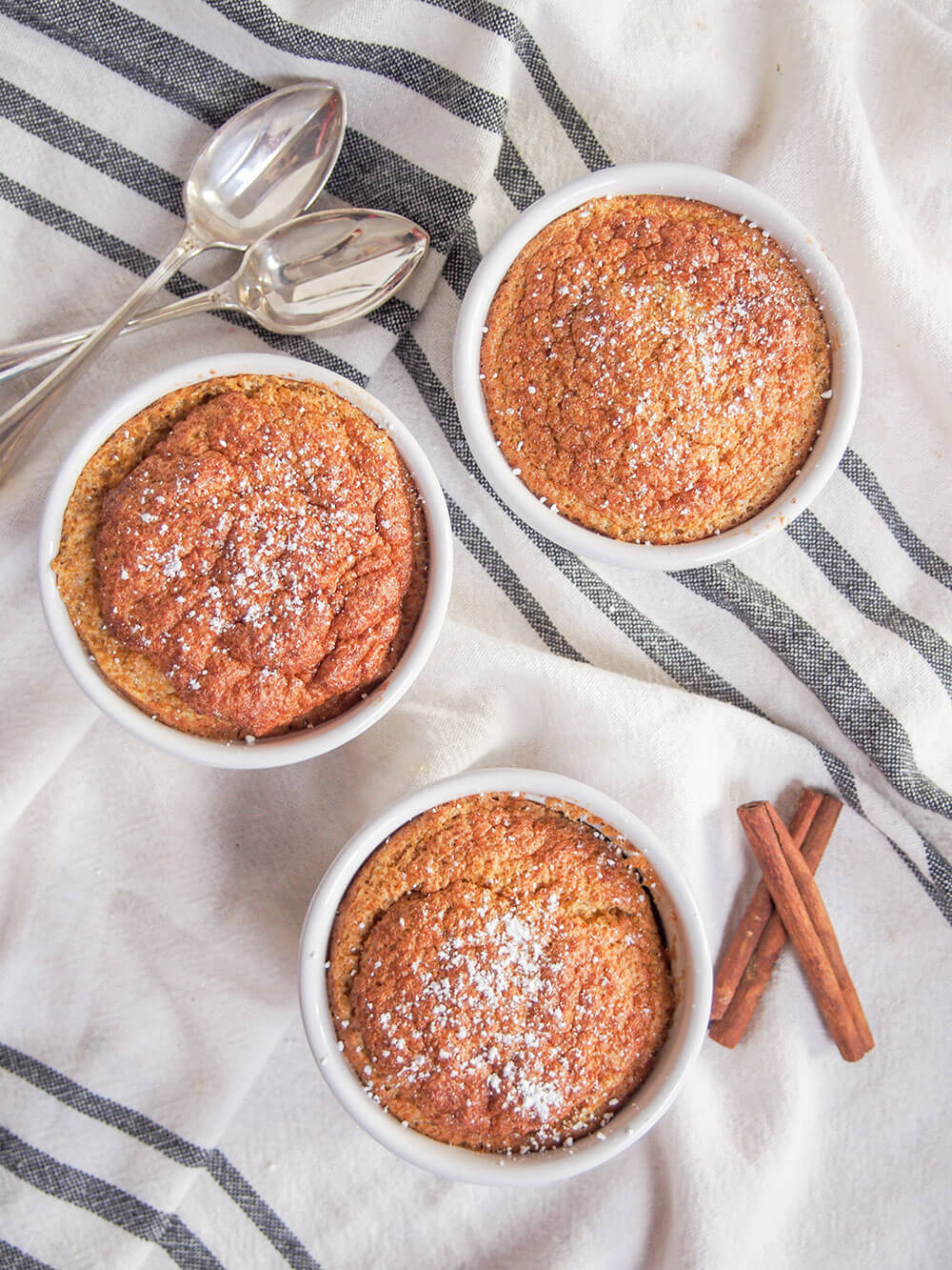 pumpkin souffle from overhead with spoons ready to dive in