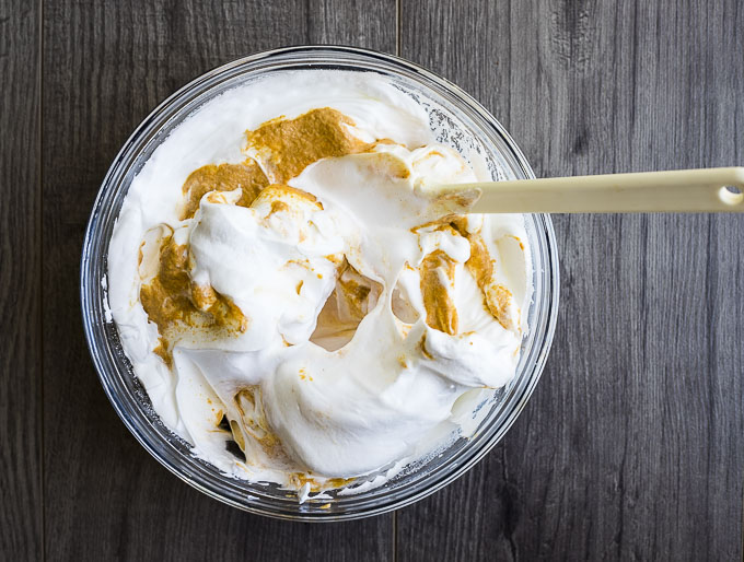 pumpkin mixture being folded into egg whites