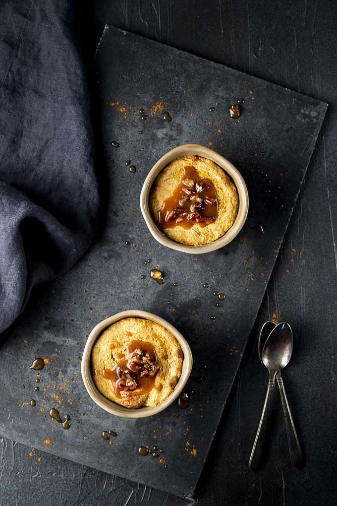 2 souffles with caramel sauce on top